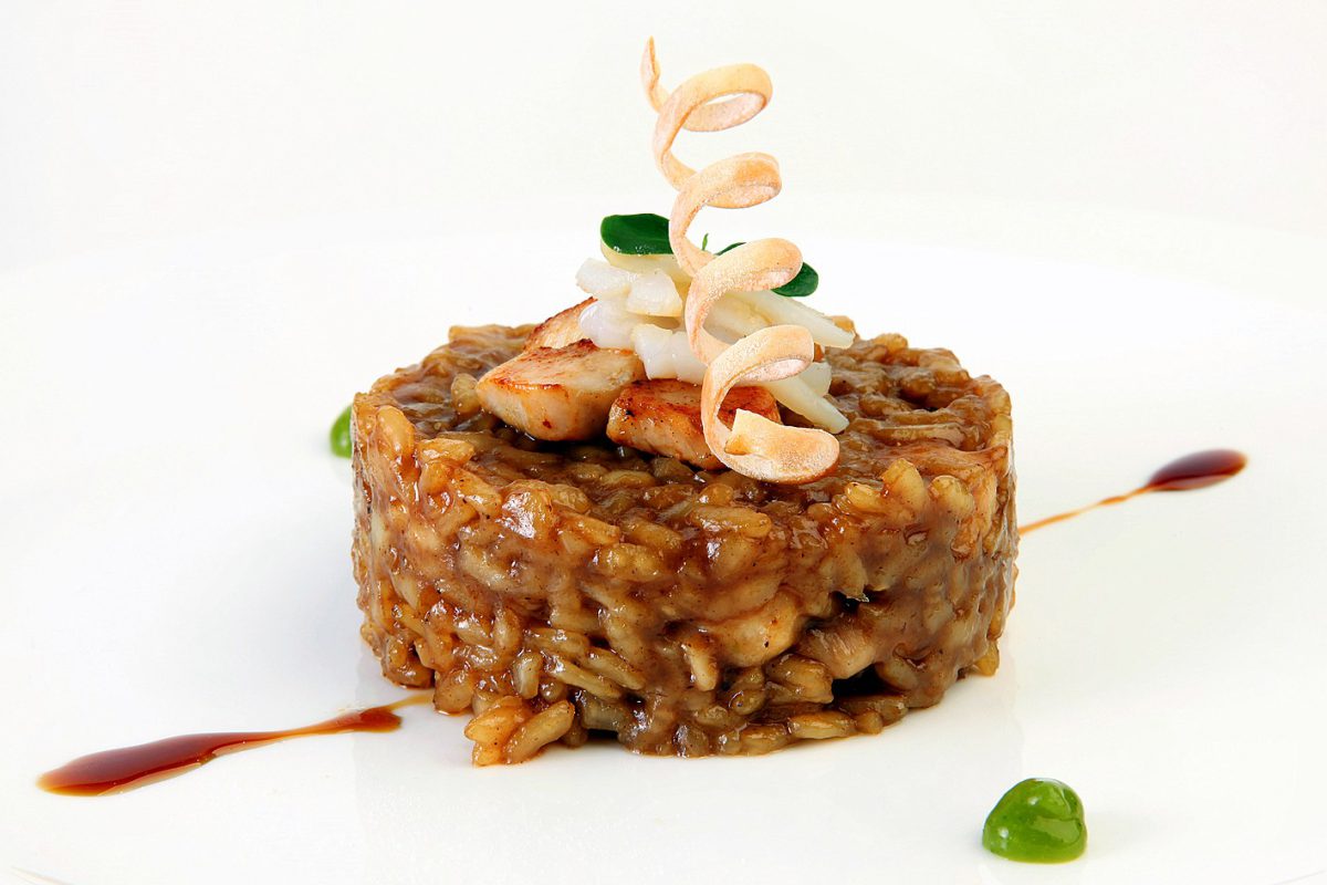 Receta de Arroz meloso de conejo y chipirón