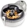 Patatas dorándose dentro de la ActiFry de Tefal, vistas a través de la tapa transparente