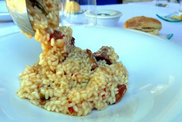 Arroz meloso de gallo y secreto ibérico