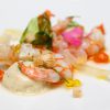 Langostino en salazón con crema helada de ajo tostado, romesco y caviar aceite de oliva