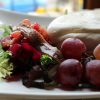 Ensalada de Burrata con tartar de tomate, granada y anchoas